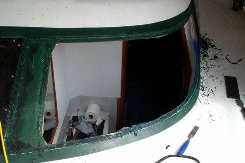 Preparing for new bathroom window on out Prout Escale Catamaran